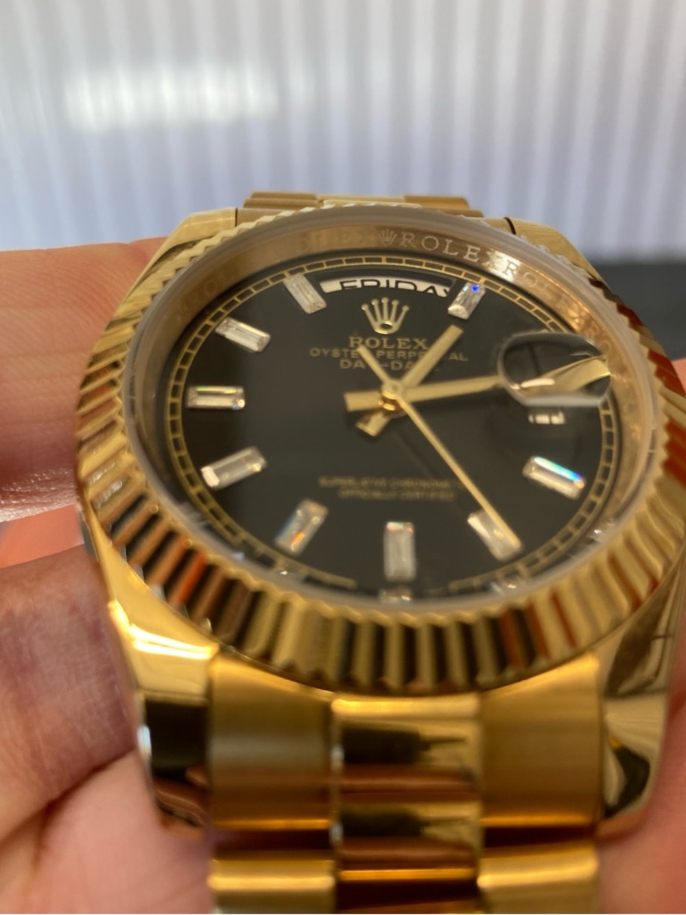 Rolex Gold Watch with Black Dial and Baguette Markers